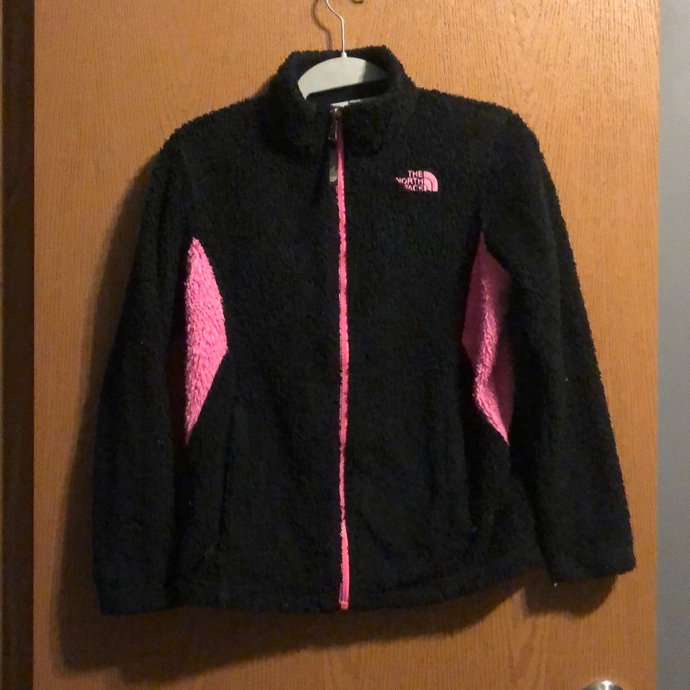 A pink and black north face